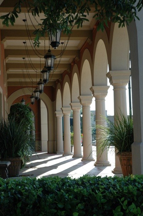 vintage lanterns on ceiling of passage with colonnade