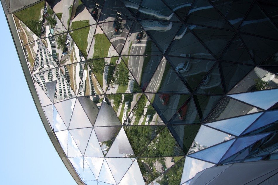 fragment of glass facade at sky, germany, munich, bmw world