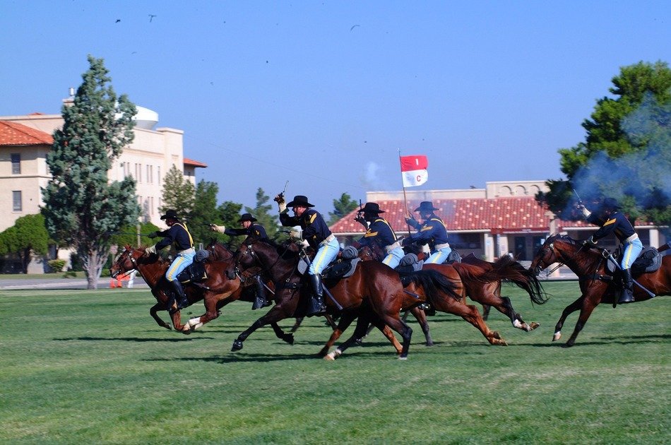 cavalry galloping on lawn in town, reenactment, usa, texas