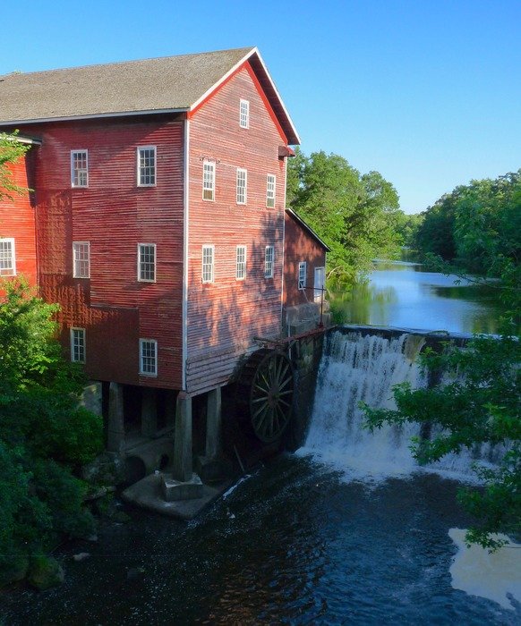 old mill at stream, usa, wisconsin