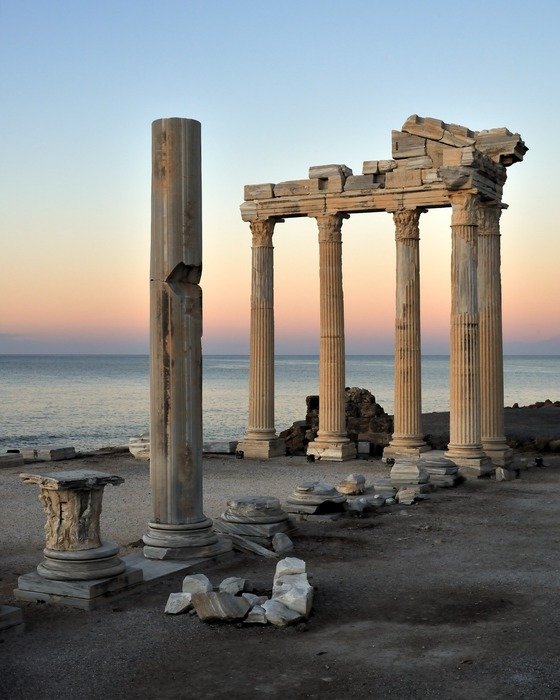 ruined ancient columns on coast at evening, turkey