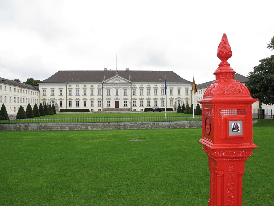 red mailbox on the background of the castle Bellevue executed in a classical architectural style