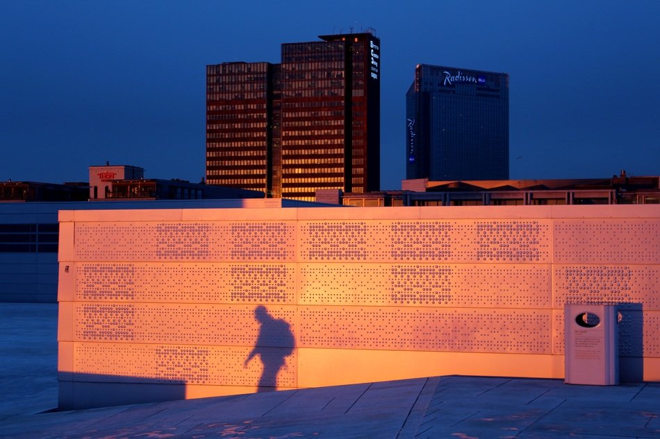 shadow of a man at the opera house in oslo