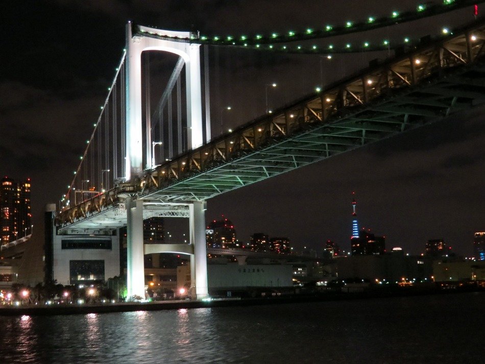 low angle view of rainbow bridge at night, japan, tokyo