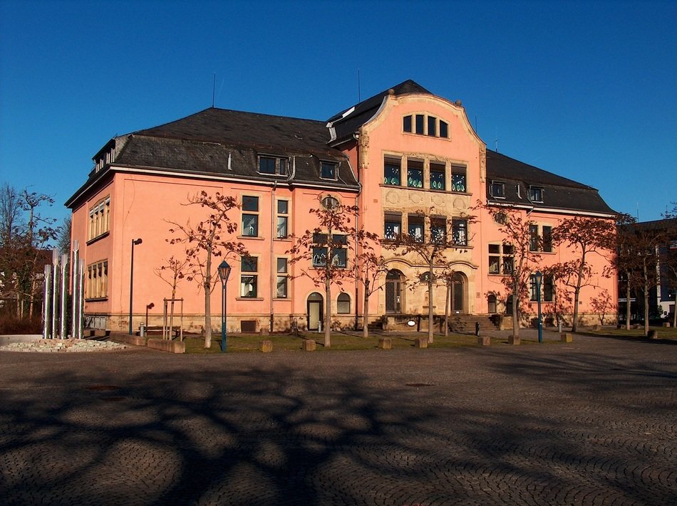 old pink school building at fall