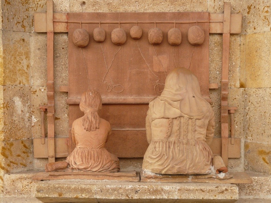 weaving women at loom, sculpture