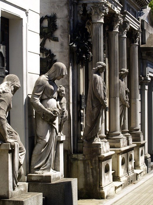stone sculptures at mausoleum in argentina, buenos aires