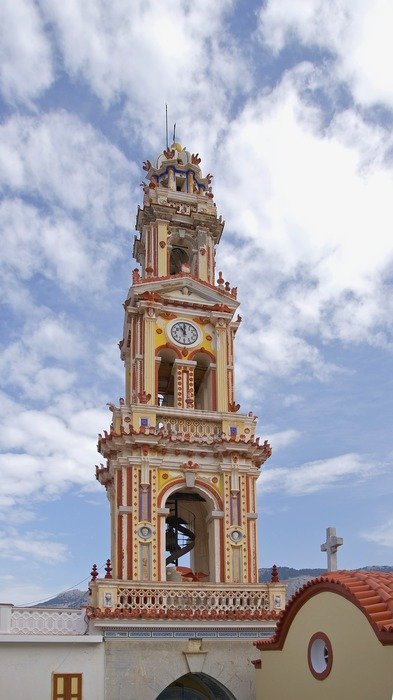 beautiful bell tower of monastery of Taxiarchis Michail at sky, greece, Panormitis