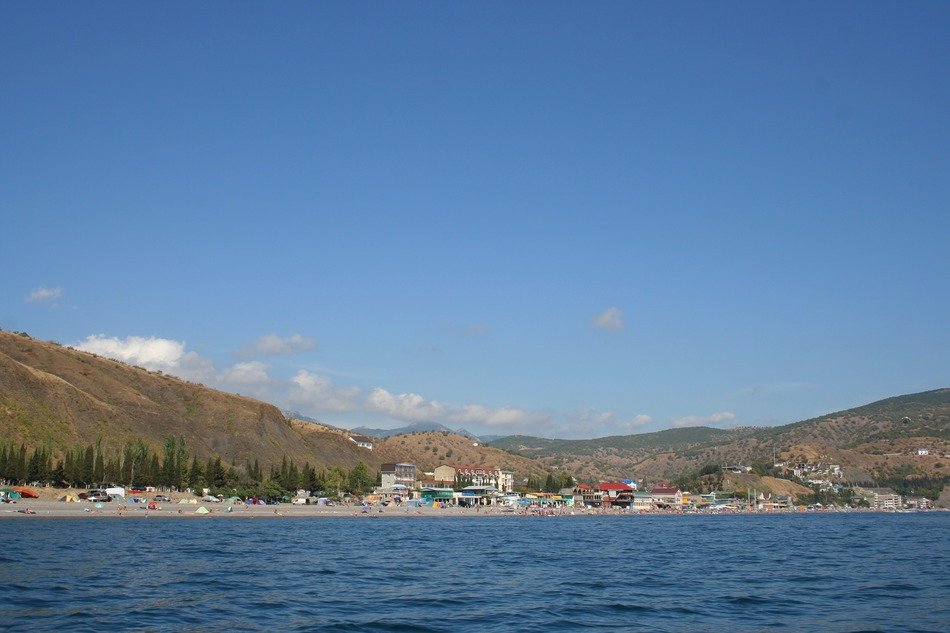 beach and village on coastline at mountains, russia, crimea