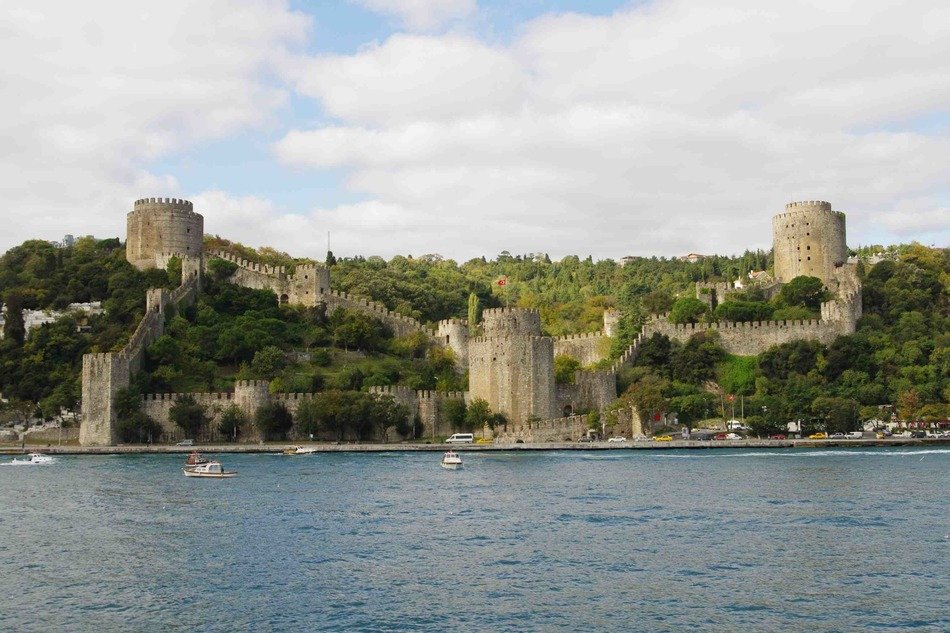 scenic coastline with Rumelihisarı or Boğazkesen Castle, medieval fortress on hills on the European banks of the Bosphorus, Turkey, Istanbul