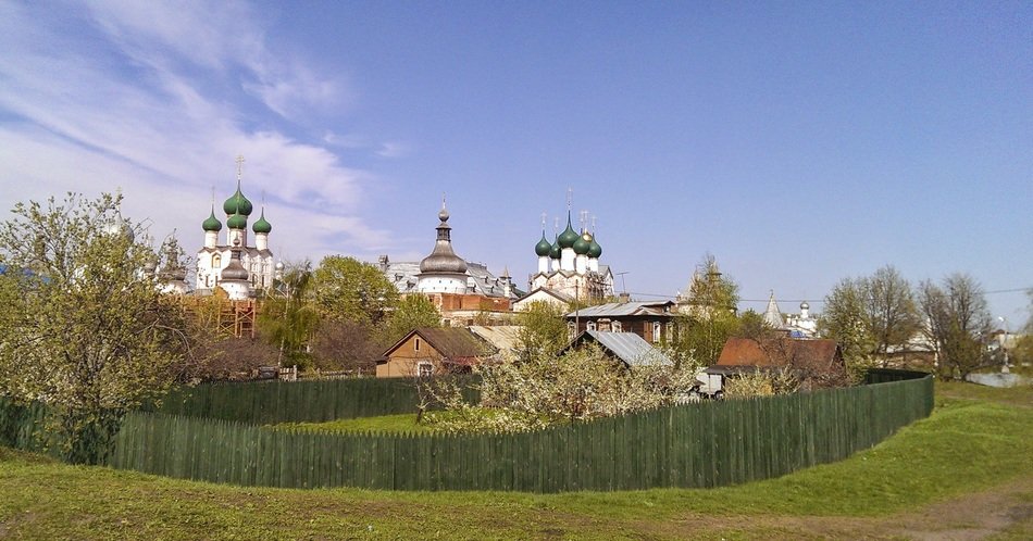 kremlin churches behind village at spring, russia, rostov