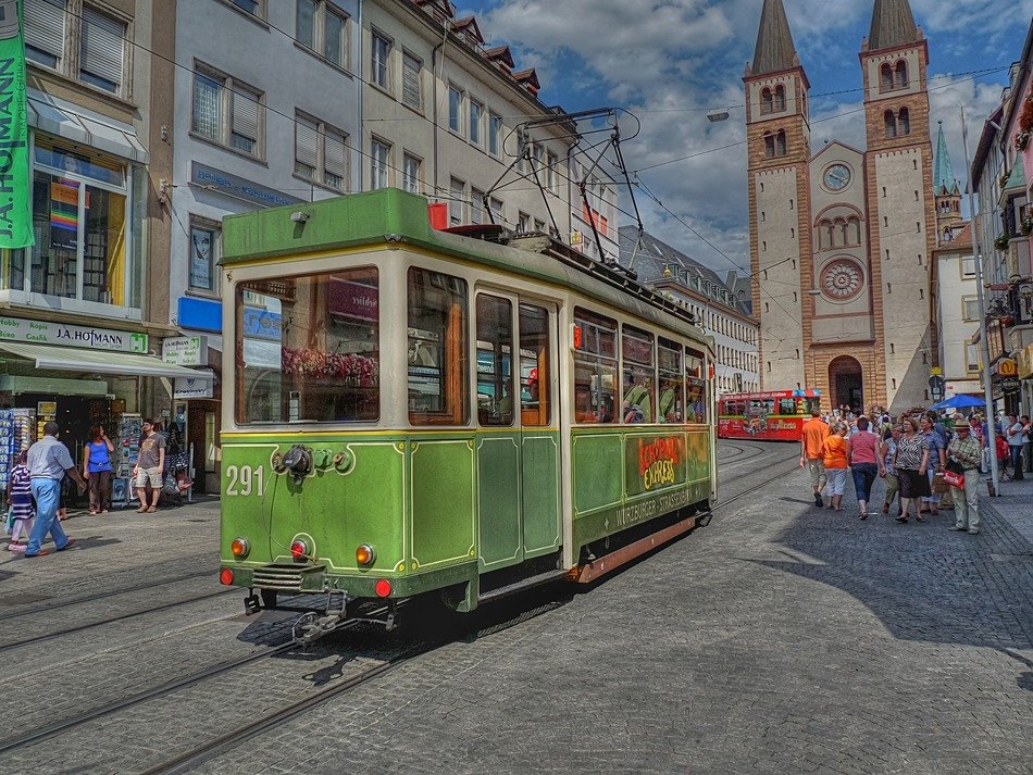 Tram on a background of the architecture of the town buildings