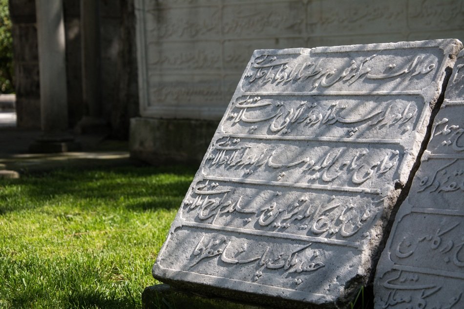 arabic stone plates on green grass