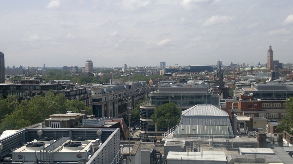 roof view of city at cloudy day, england, london