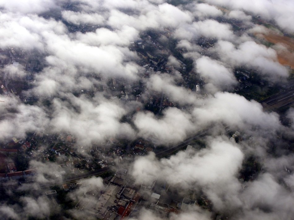 aerial view of city through clouds