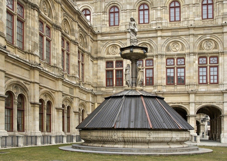 covered fountain in courtyard of opera house, austria, vienna