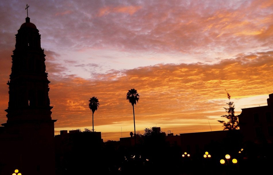 silhouette of PurificaciÃ³n church in city at sunset sky, mexico, zacatecas, fresnillo