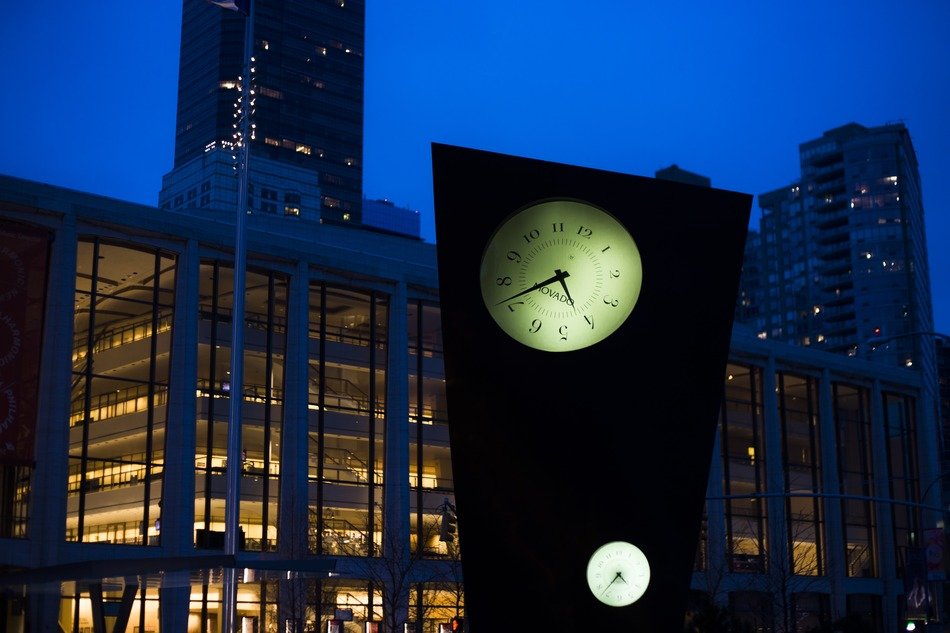 Illuminted clock in New York at night