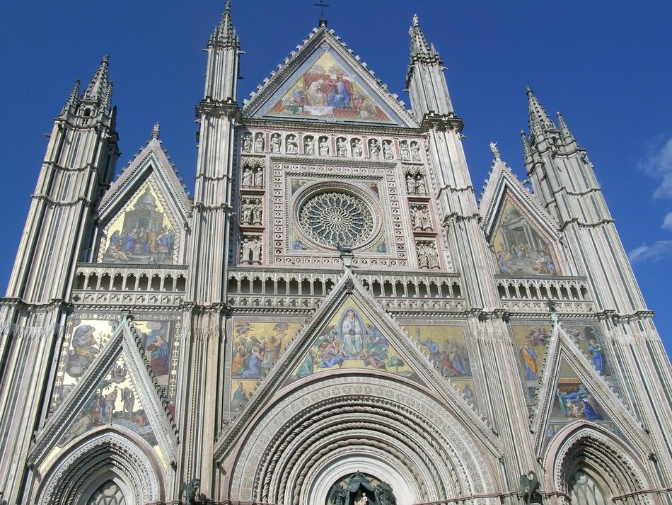 ornate gothic facade of cathedral at sky, italy, umbria, orvieto