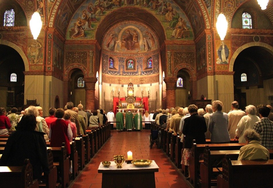 people standing in church during messa, germany, berlin