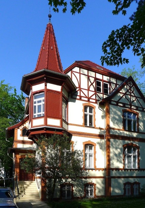 turret with spire on facade of aged house, germany, berlin