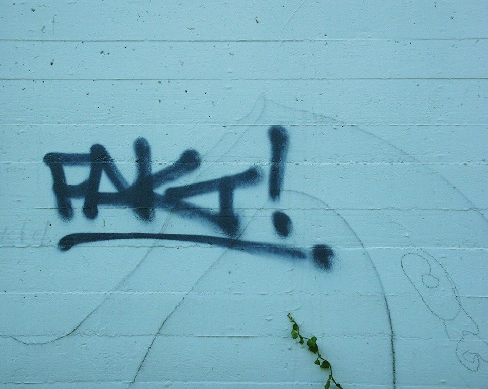 spray text on the blue wall