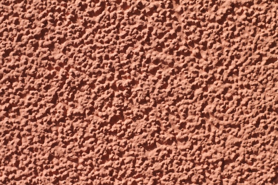 grained pink plaster, background