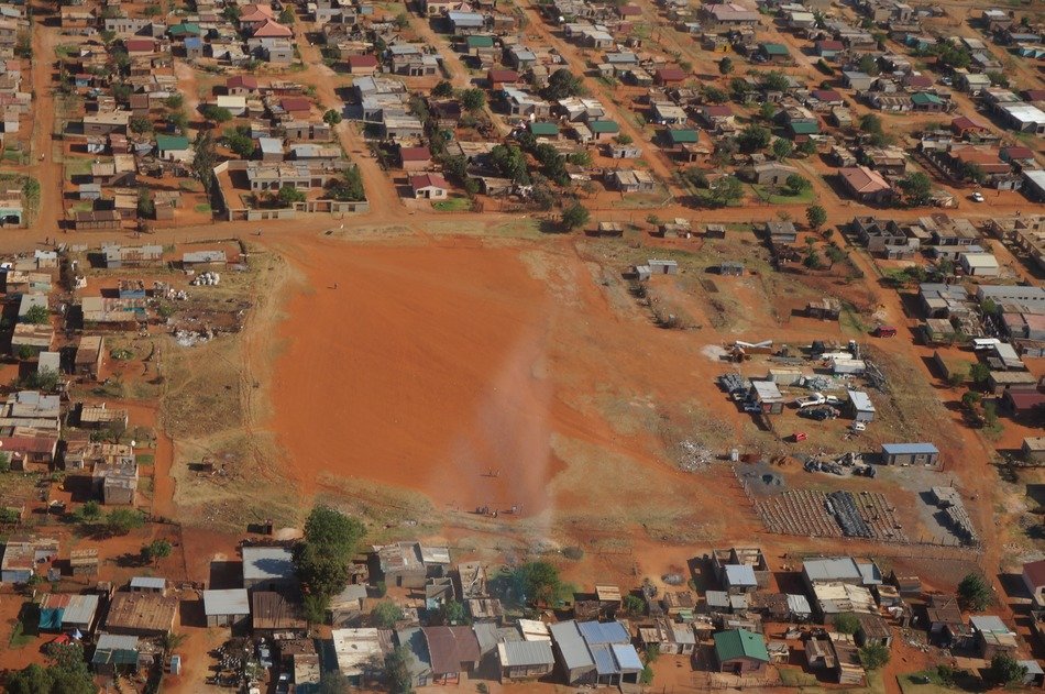 aerial view of settlement on red soil
