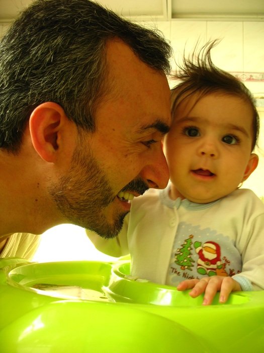 smiling father with baby daughter, family happiness