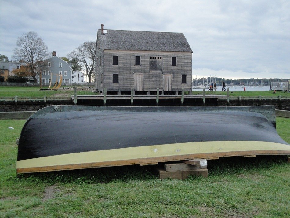 rowing lifeboat near a barn in the countryside