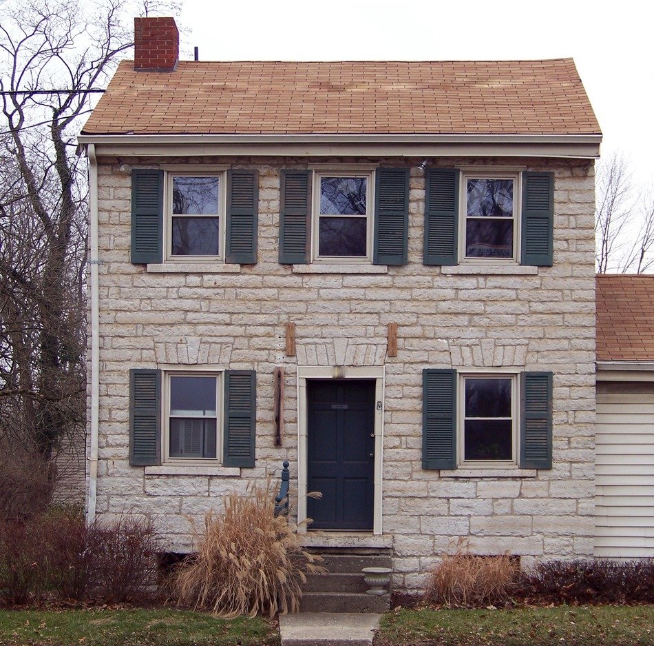 two-storey stone house at winter