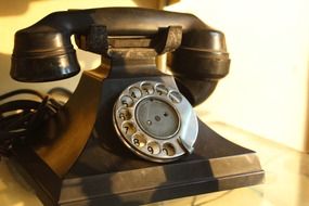 Vintage antique telephone made of the wood