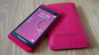 smartphone blackberry in pink case