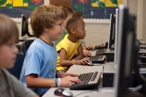 children study in a computer class