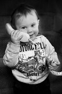 monochrome portrait of baby boy calling