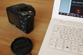 camera, notebook and lens cap