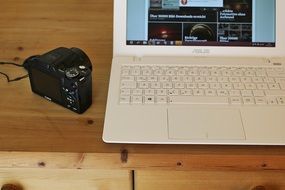 camera with notebook on the table