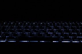 black laptop keyboard at darkness