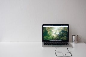 laptop on a white table