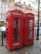 two red telephone boxes in London