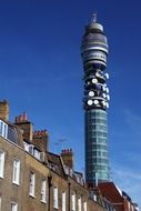 Tower-transmitter on the background of residential buildings