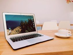 laptop on a wooden table in the office