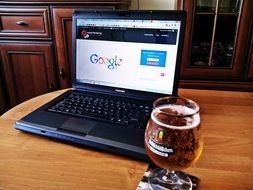 beer and laptop on the table