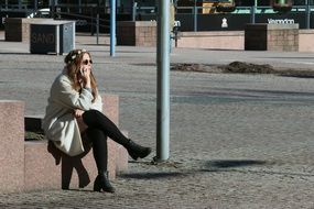 young girl having communication by the phone