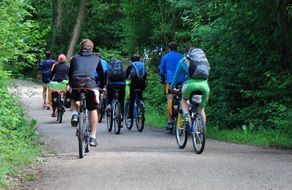 group of people on bicycles in the park