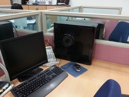 two monitors on the computer desk of the manager