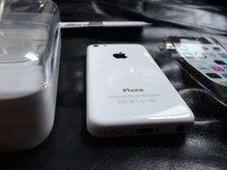 White iphone 5c on the table