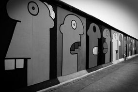 Grey photo of wall graffiti in Berlin