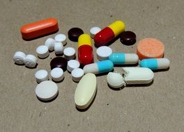 Colorful pills of different shapes