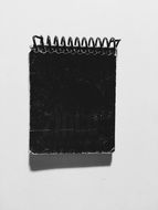 black notebook on a spring